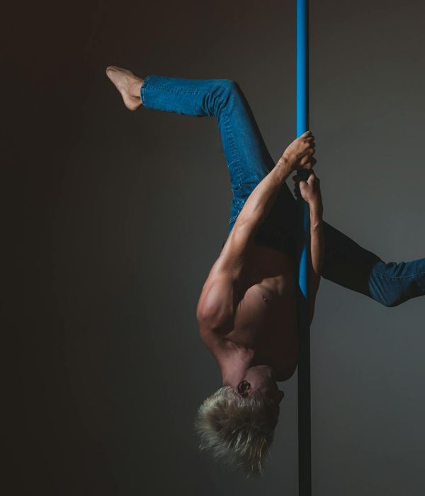 Man performing a controlled strength exercise in a calm environment.
